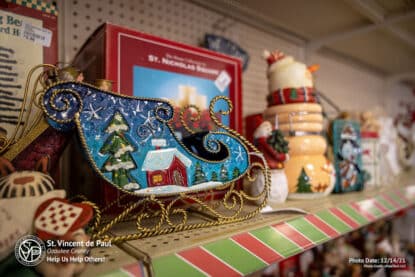 Colorful Santa's sleigh and ceramic Christmas decorations at SVDP Ozaukee County in Port Washington, WI.