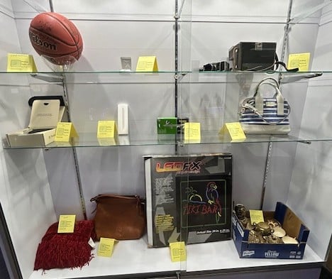 SVDP Ozaukee Silent Auction - July 2025 SVDP Ozaukee County July 2025 Silent Auction items in display case.