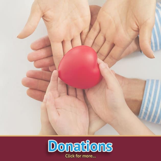 Ozaukee county donations to the Port Washington, WI thrift store showing hands holding a read heart.